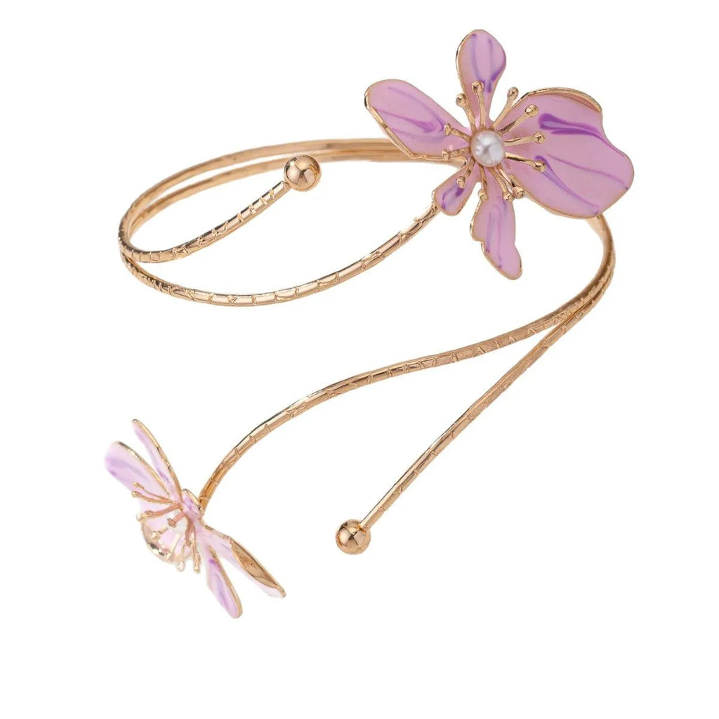 Close-up of a pink alloy fashion arm ring with a hollow armband lines pattern design.