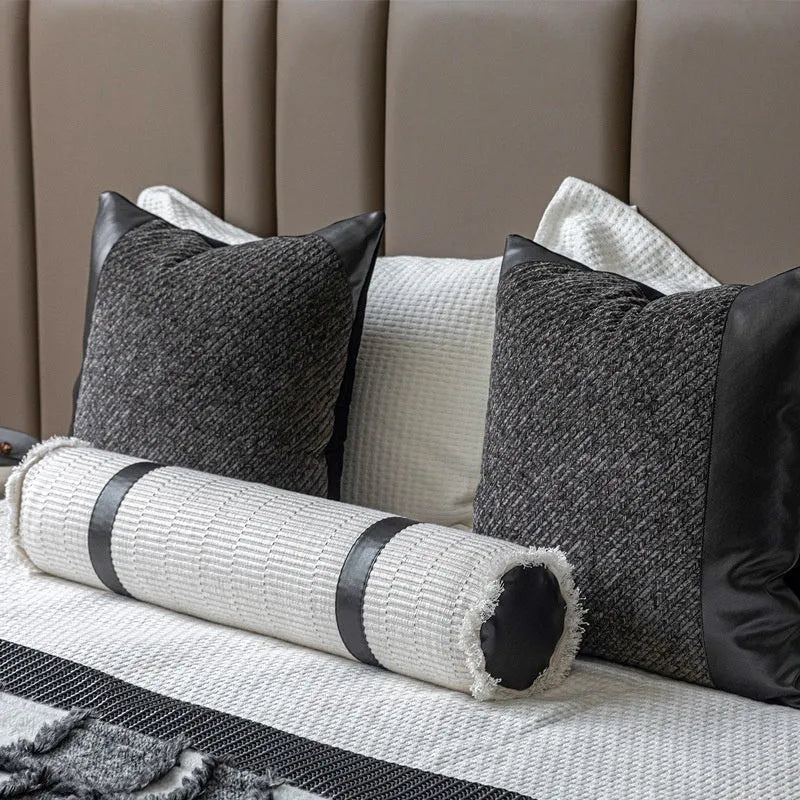 Modern minimalist grey and white plaid bed runner blanket set with pillow on a double bed.