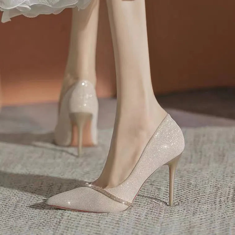 Gold and black women's stiletto high heels with pointed toes, shown with 6cm and 9cm heel options.