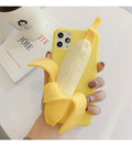 Yellow silicone banana-shaped phone case with unzip detail for iPhone models.