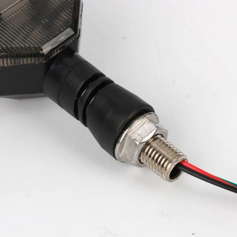 Arrow-shaped 12V LED motorcycle turn signal light in yellow with choice of blue, red, or white accent.