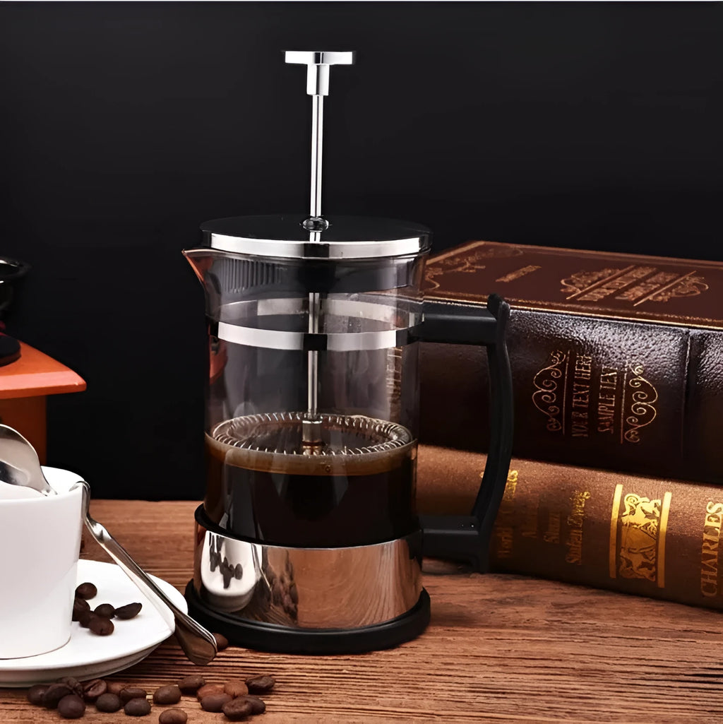 Compact 350ml capacity coffee maker made of glass and stainless steel.