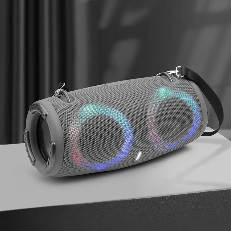 Portable Bluetooth speaker with RGB lights in multiple colour options on a strap.