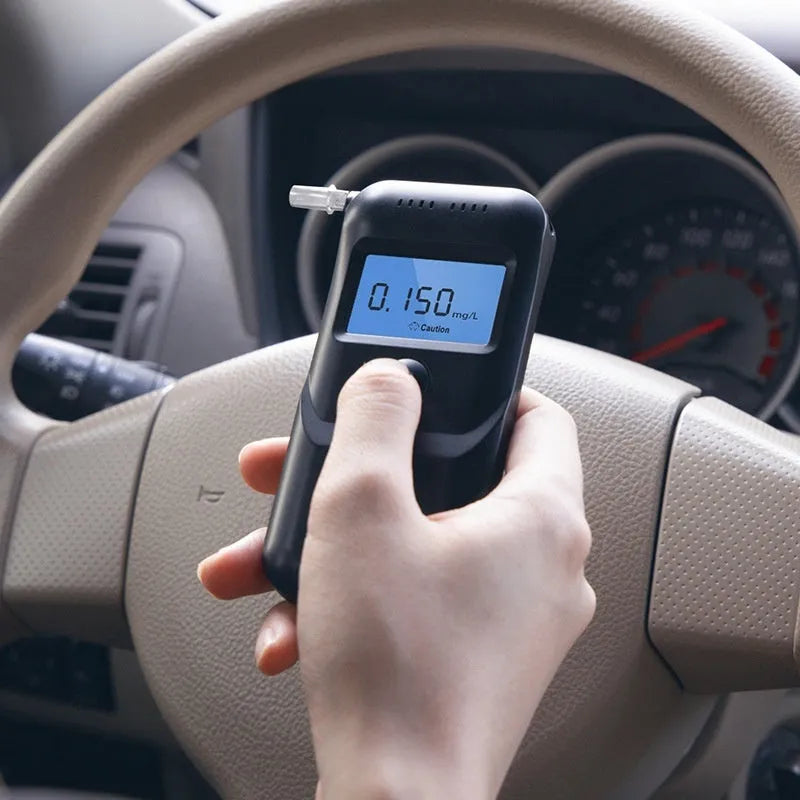 Black household alcohol breathalyser tester for personal drinking level monitoring