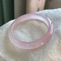 Natural agate wide bead bracelet in pink on a wrist, showing 10mm bead width and smooth stone texture.