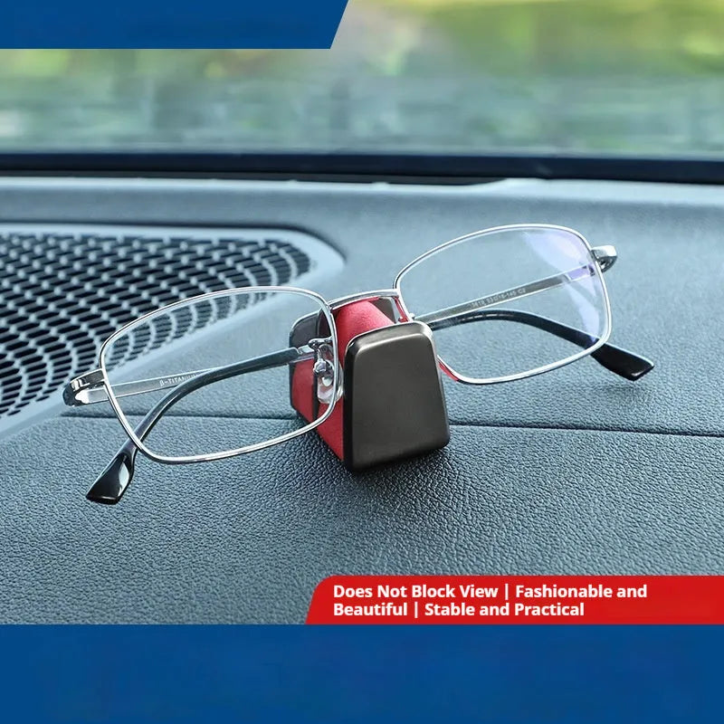 Zinc alloy and leather glasses clip for car dashboard in black, grey, green, or red.