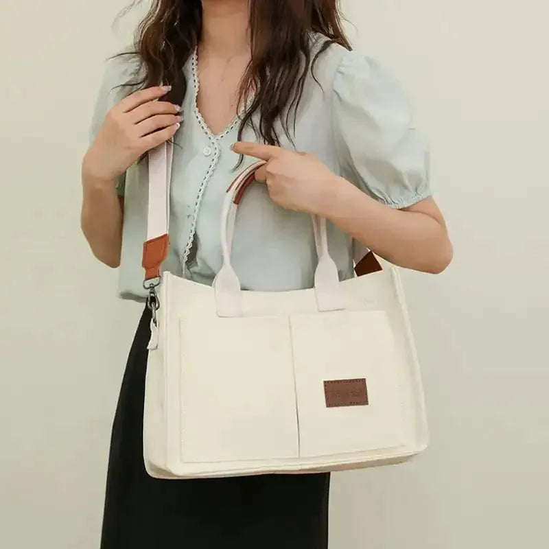 Large casual canvas tote shoulder bag for women with multiple pockets in creamy white