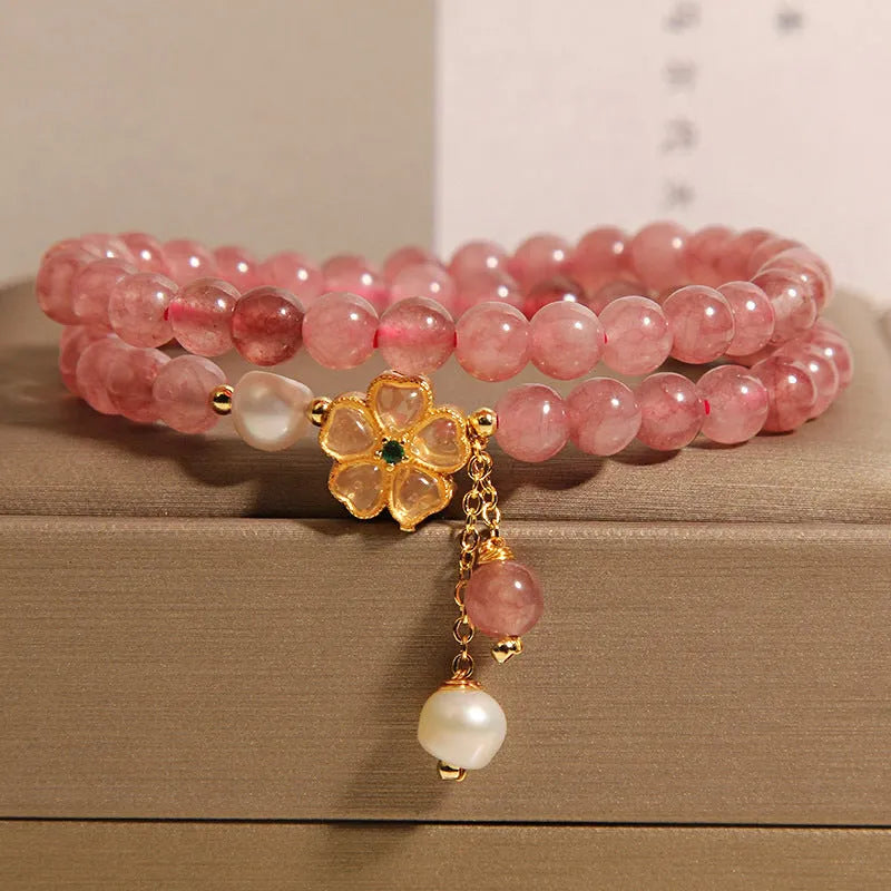 Women's double ring bracelet with a strawberry quartz twin four-leaf clover design.