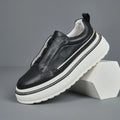 Breathable casual slip-on sneaker in black with first layer cowhide upper, platform mid heel, and sewing thread detail