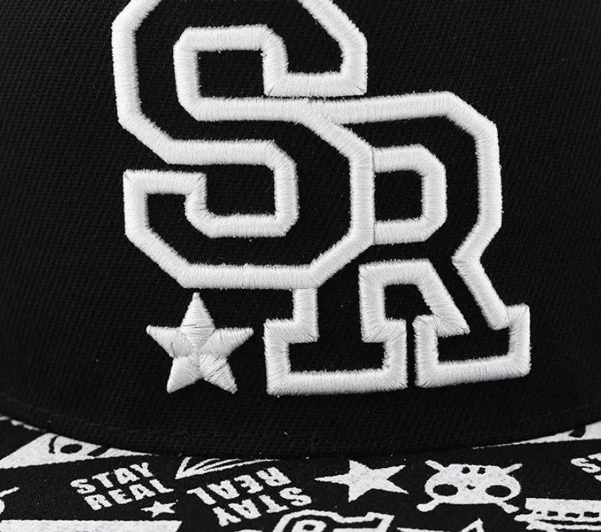 Black and white cotton baseball cap with embroidered letter design on the front.