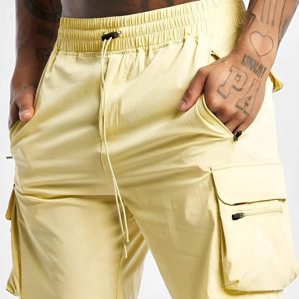Man's black quick-drying sports shorts with elastic waistband for fitness and running activities.
