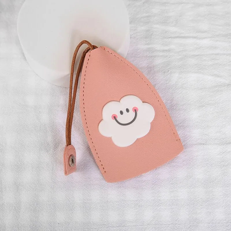 Cartoon pull-out key case in PU leather measuring 14 x 7.5 cm with colourful designs