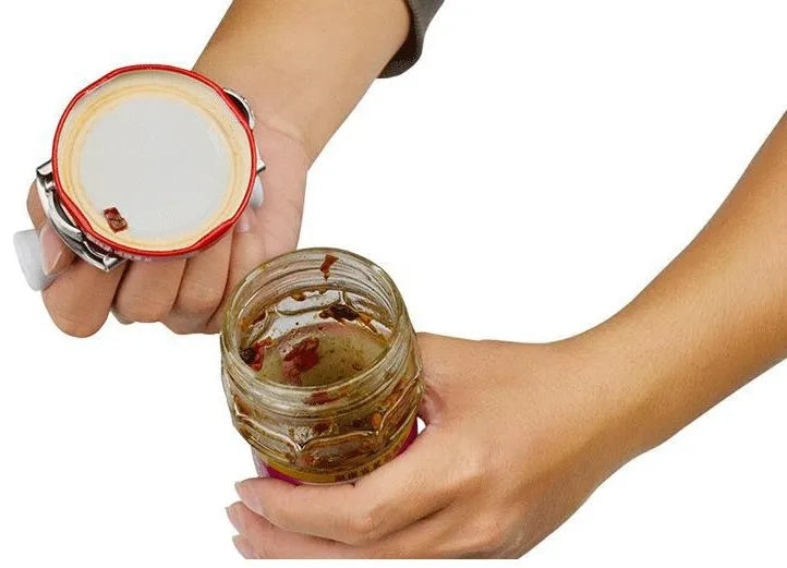White adjustable stainless steel bottle cap opener with gear mechanism and textured handle.
