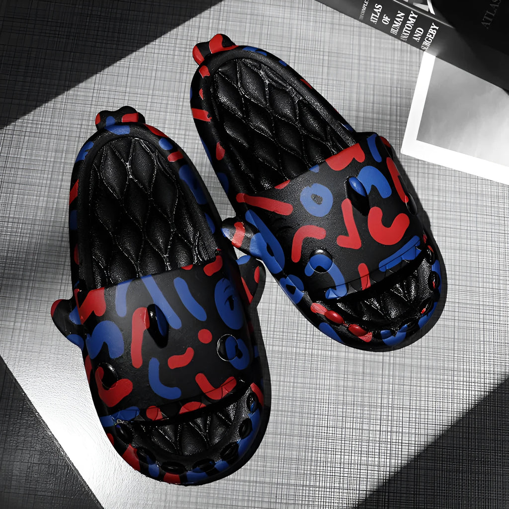 Pair of grey EVA open-toe slippers featuring a large raised shark design on the upper.