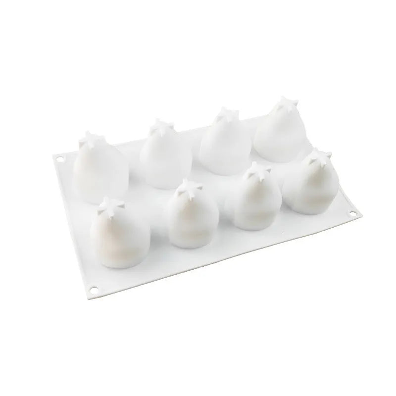 Silicone baking mould with six cavities showing pineapple and pine cone shapes for mousse desserts
