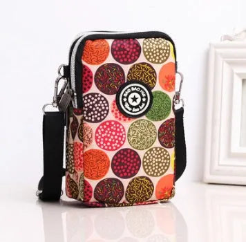 Women's vertical Oxford mobile phone bag with zipper and printed design options including florals and cartoons.