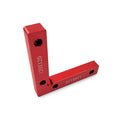 Aluminium alloy right angle woodworking positioning block on a workbench.