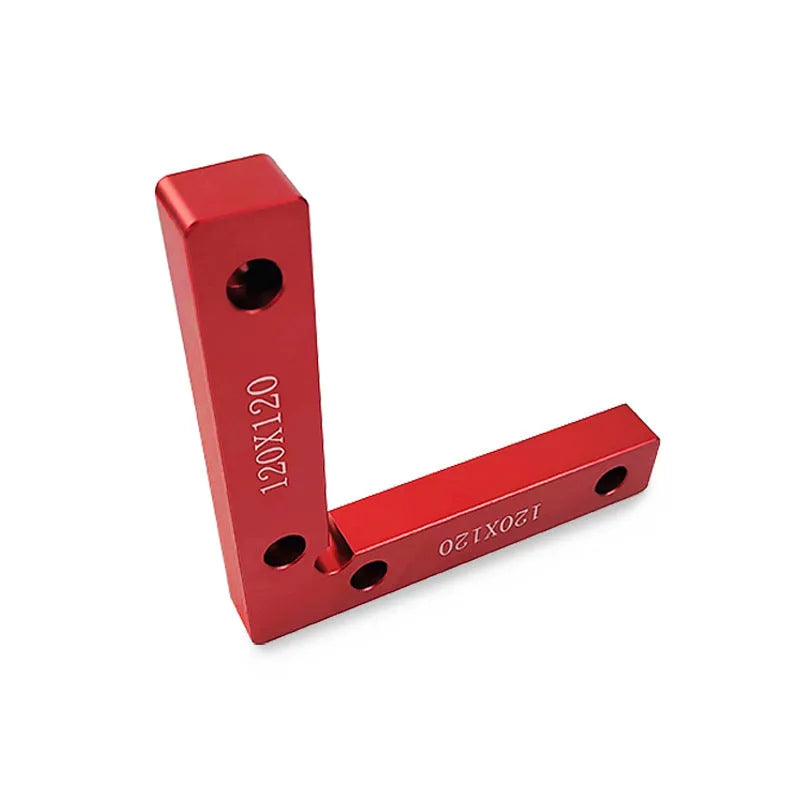 Aluminium alloy right angle woodworking positioning block on a workbench.