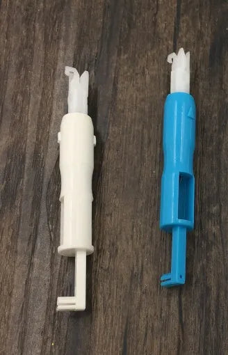 Needle threader insertion tool for sewing machine, plastic and metal, 7.2cm length, shown on white background