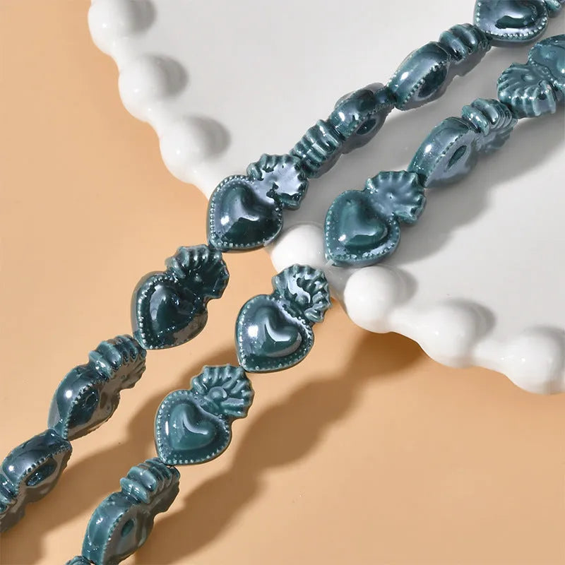 Ceramic love heart small torch shaped beads in various colours with straight holes for jewellery making