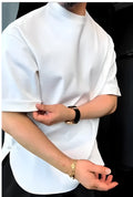 White men's buttoned t-shirt with long sleeves and a round hem laid flat.