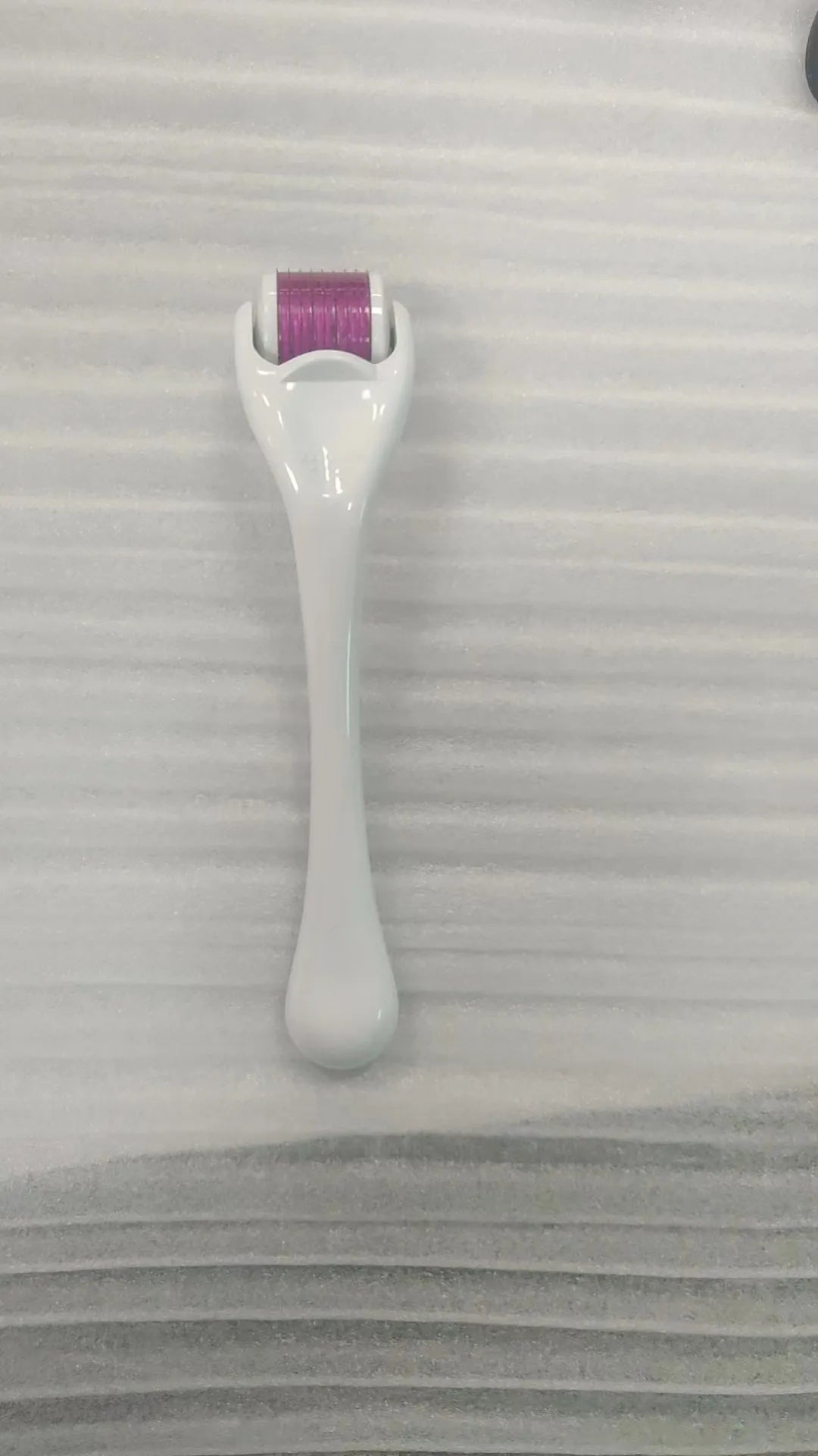 540 micro needle mechanical derma roller with black handle and coloured wheel options