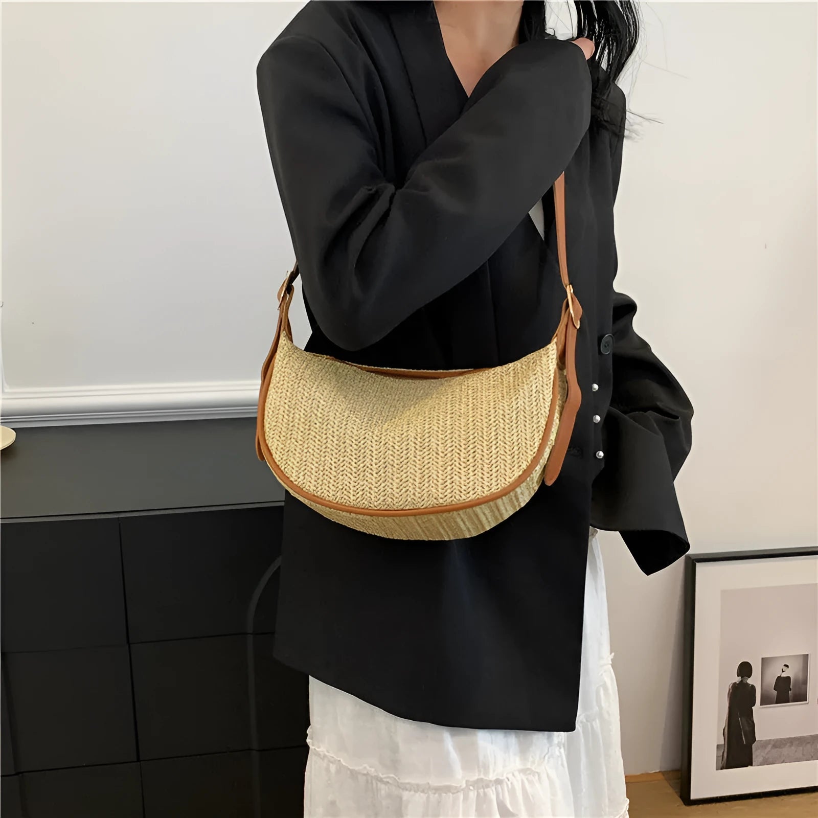 Straw woven crossbody bag showing woven texture and internal phone compartment