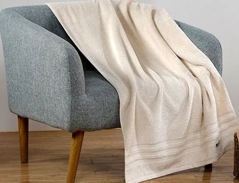 Cotton towel set in beige and brown showing three different sizes including large bath towel