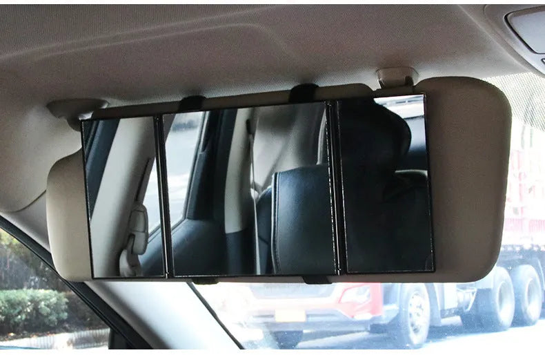 Silver car folding makeup mirror shown closed at 15.5 cm and opened at 30.5 cm wide.
