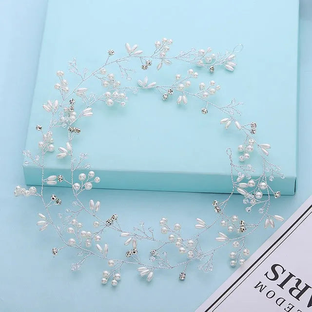 Silver bride's long hair band with crystals and pearls for wedding updos.