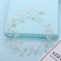 Silver bride's long hair band with crystals and pearls for wedding updos.