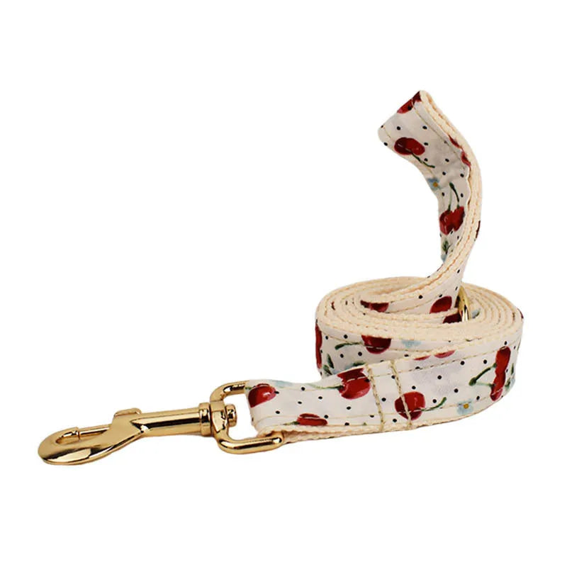 Red cherry printed cloth dog collar with light gold buckle and detachable bow strap