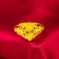 Geometric gold open ring with textured diamond flower detail on brass