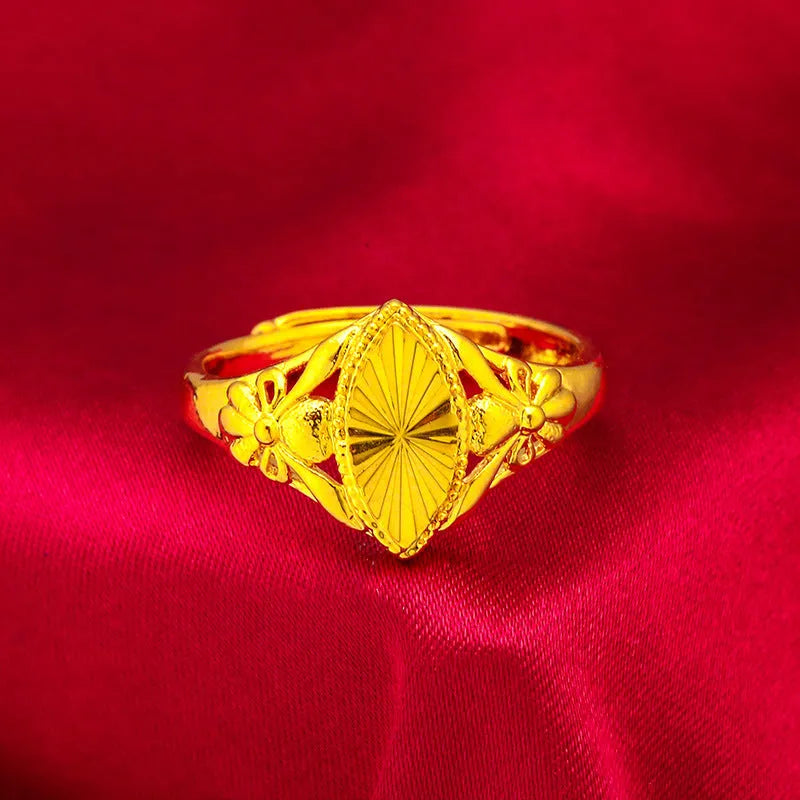 Geometric gold open ring with textured diamond flower detail on brass