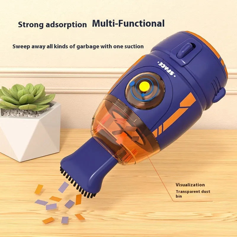 Handheld cordless desktop vacuum cleaner in blue rocket design with USB charging cable.