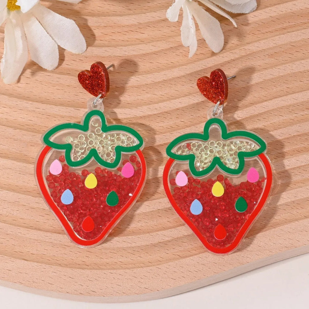 Colourful acrylic earrings with realistic fruit and dessert charms including cherry, strawberry, and ice cream.