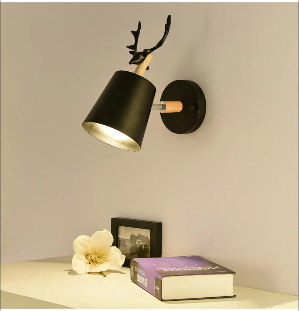 Modern antler bedside wall lamp in black iron and wood, 24x29cm with E27 bulb base.