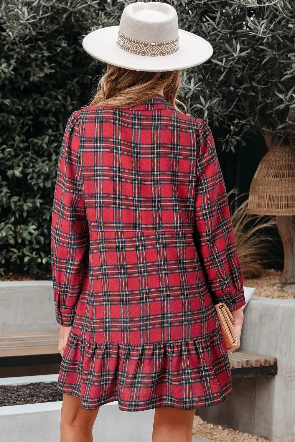 Red plaid mini dress with shirt collar, long sleeves, half-button front, and ruffle hem