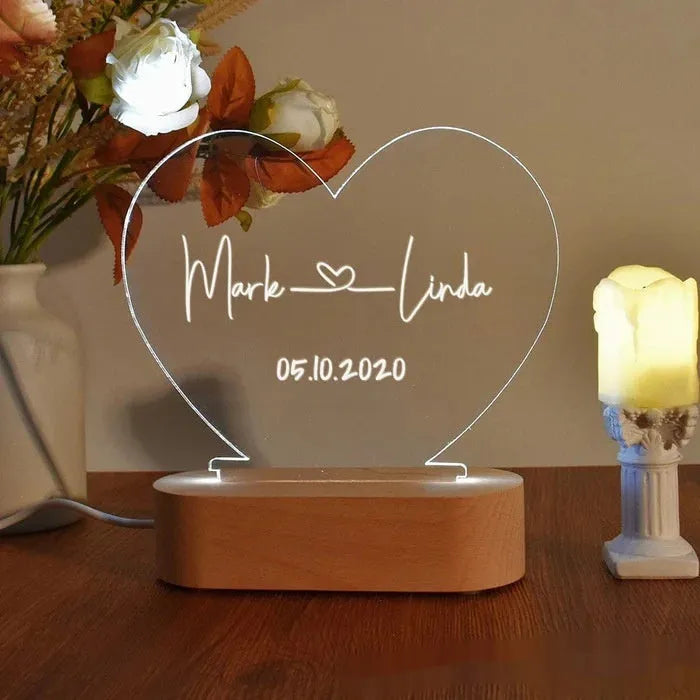 Personalised acrylic night light displaying custom names and date for Valentine's Day gift.