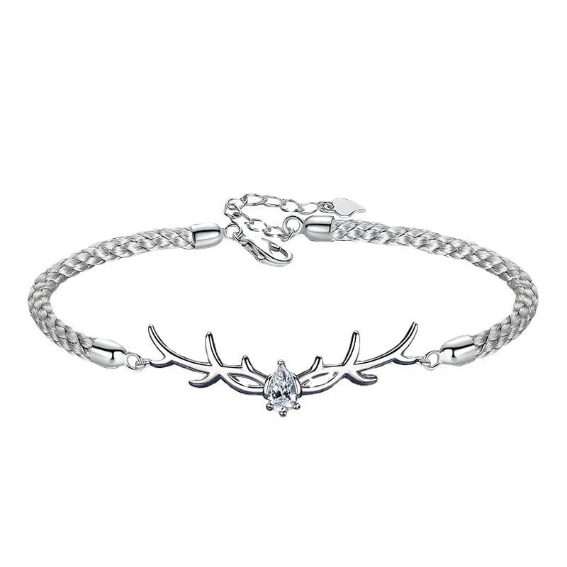 Yi Lu Has You braided rope bracelet in copper with animal zodiac design on display