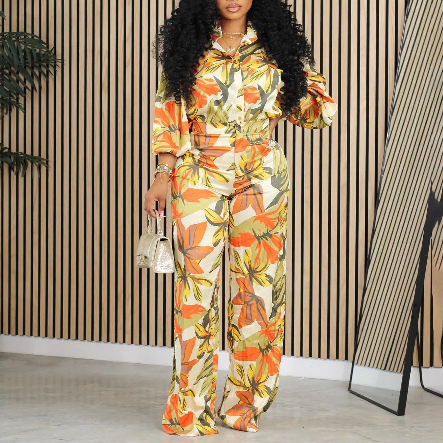 Red printed polyester two-piece suit with long sleeve shirt and wide leg trousers