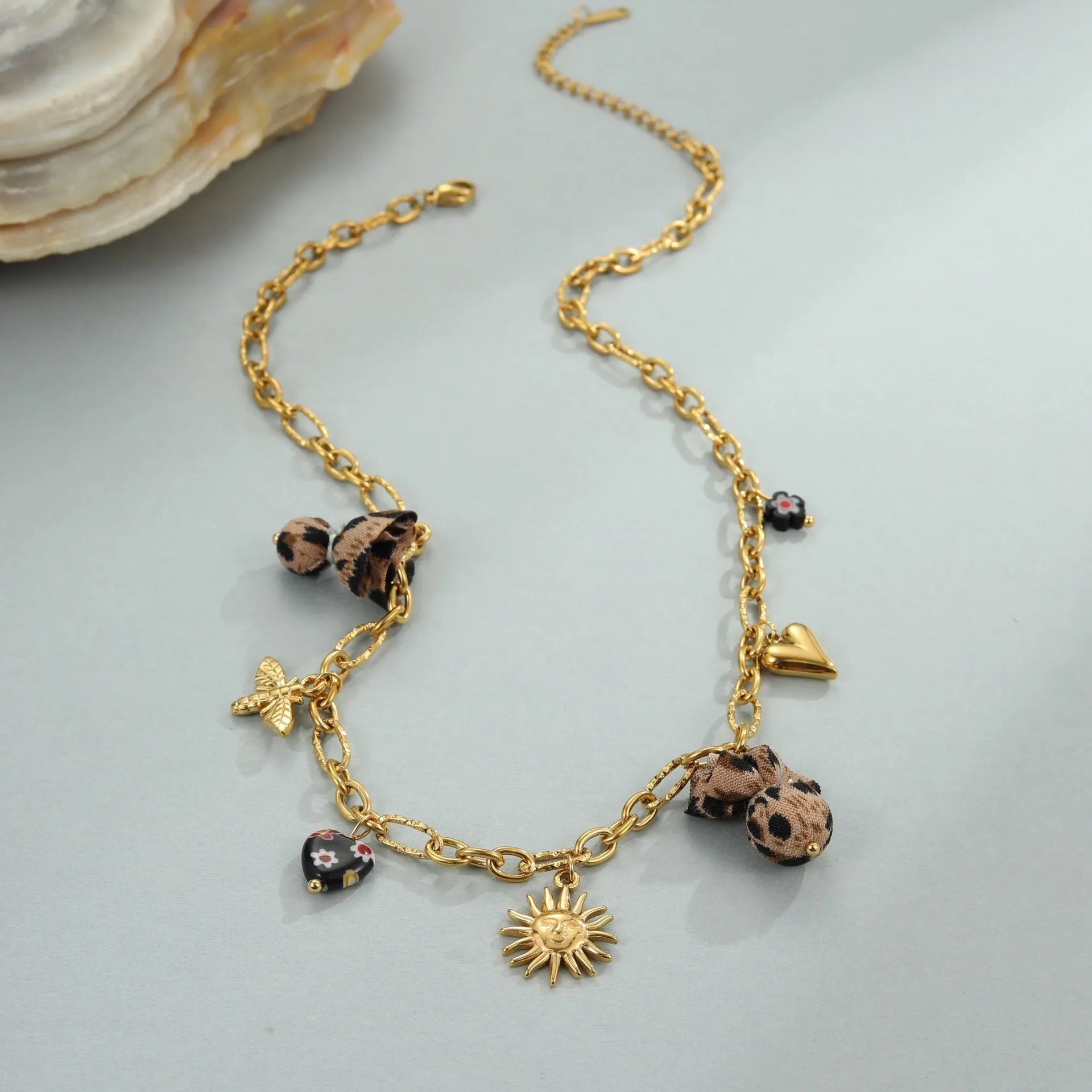 Stainless steel necklace with geometric leopard, hearts and flowers pendant on adjustable 41-50cm chain