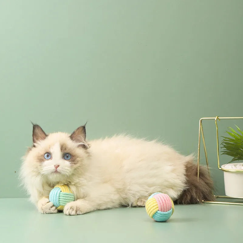 Handmade plush cotton cat hair ball toy in blue powder, green blue, or pink green colours.
