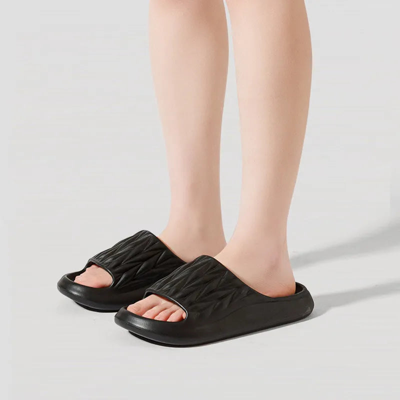Leaf texture pattern EVA foam slippers for men and women in various colours on a white background.