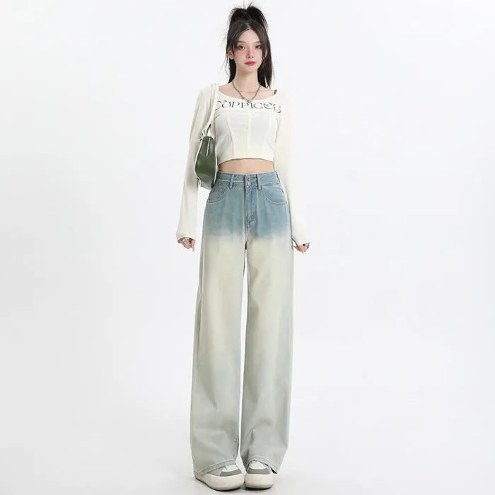 A pair of women's gradient blue wide-leg denim trousers on a neutral background.