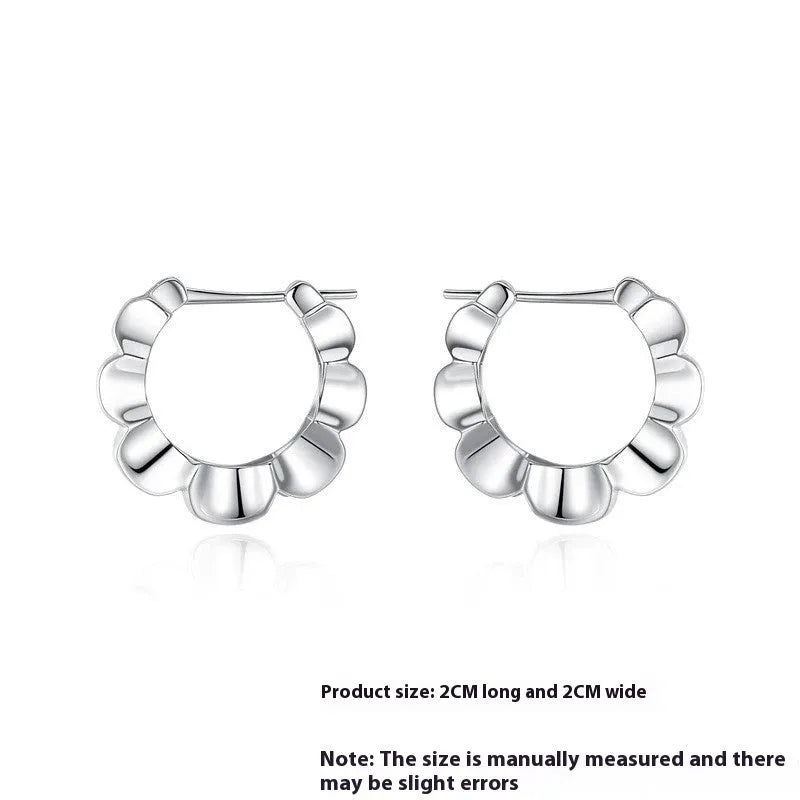 Pair of sterling silver geometric hoop earrings with round elements and electroplated finish