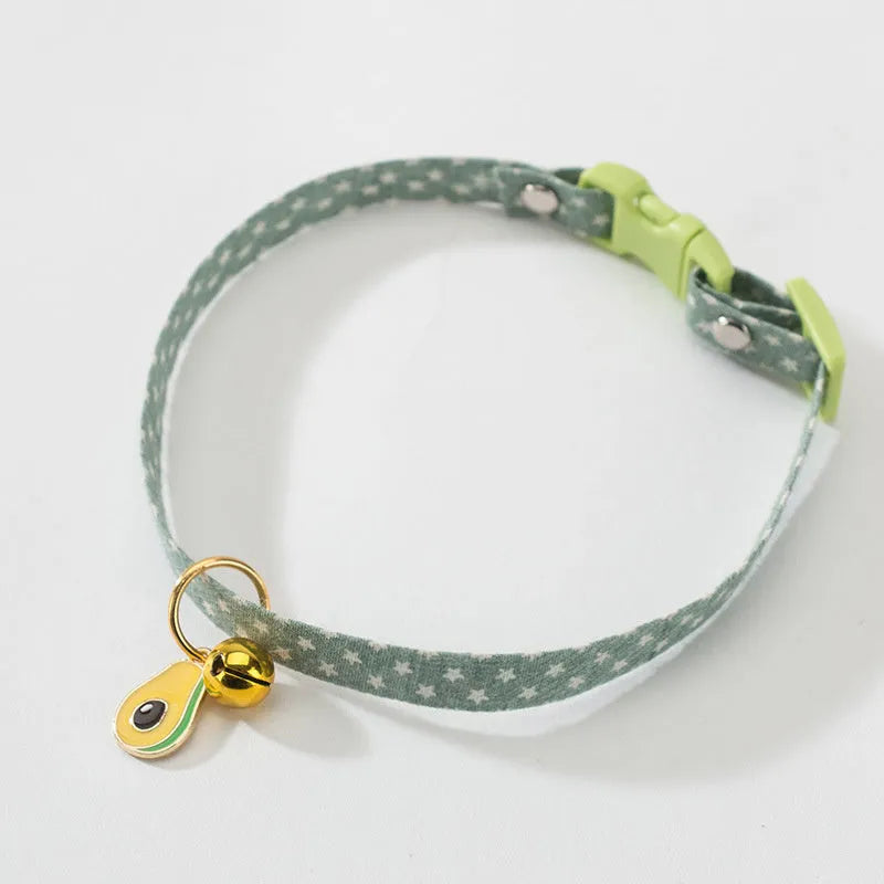 Adjustable cat collar with bell and bow tie decoration on small dog
