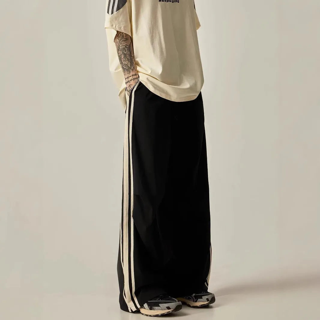Black high-waisted wide leg straight trousers for men, made from polyester fibre.