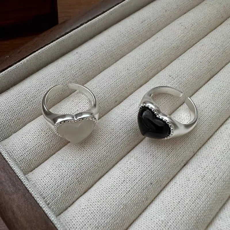 Adjustable open mouth ring with black agate stone and heart design in sterling silver