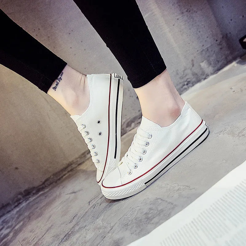 Women's casual canvas shoes in solid colours: all-black, black, white-black, and white-red.